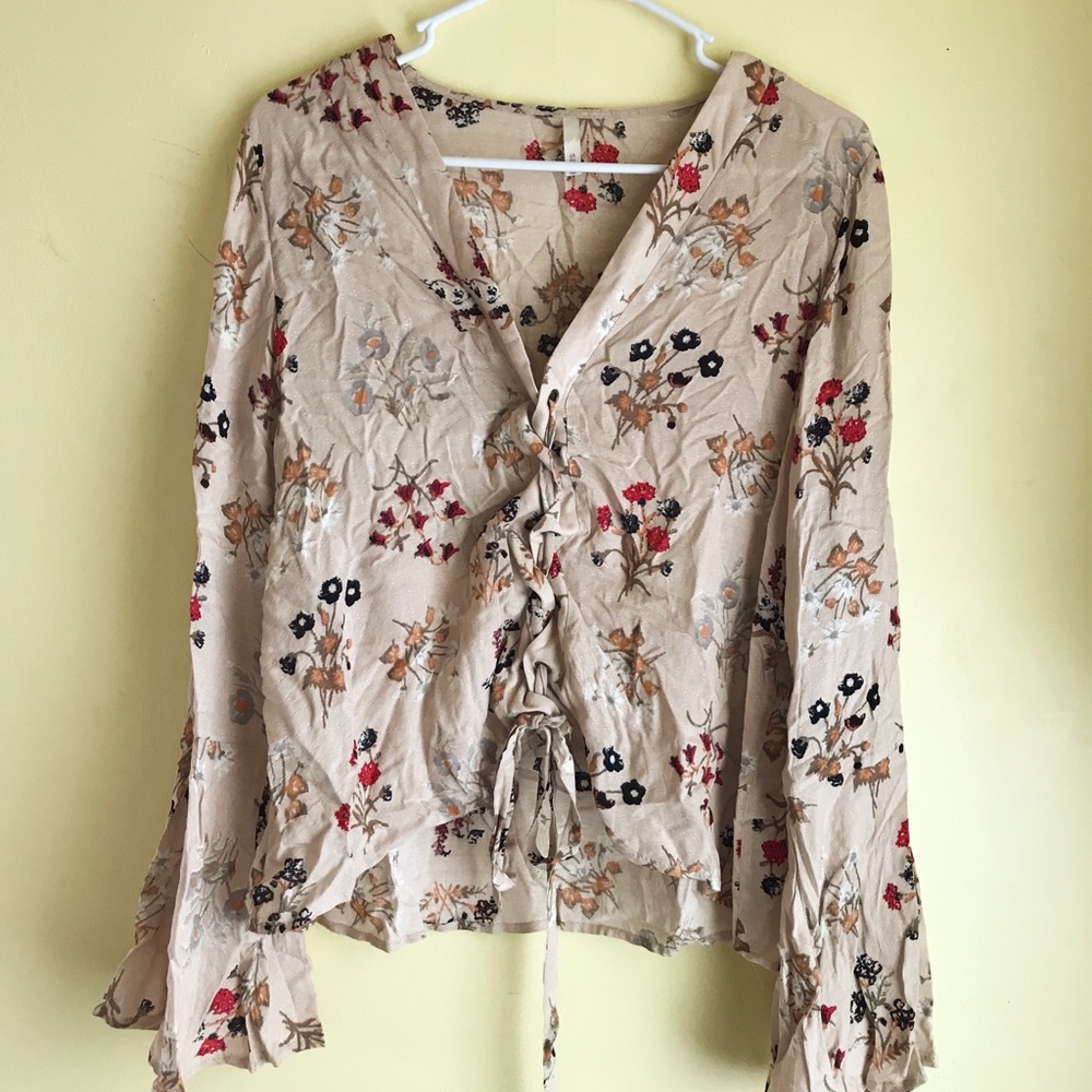 Francesca’s Flowy floral lace-up top
